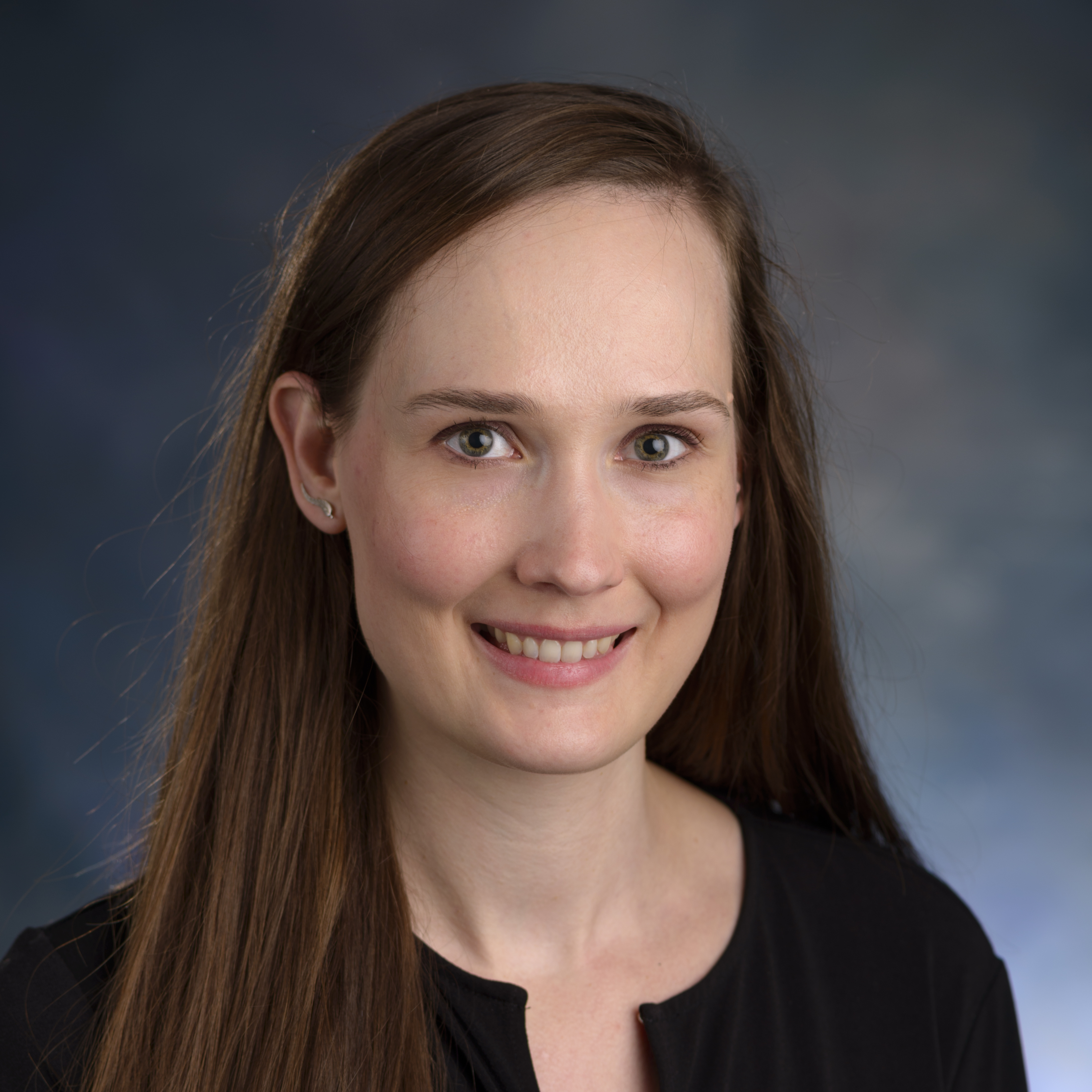 Woman smiling with blue background